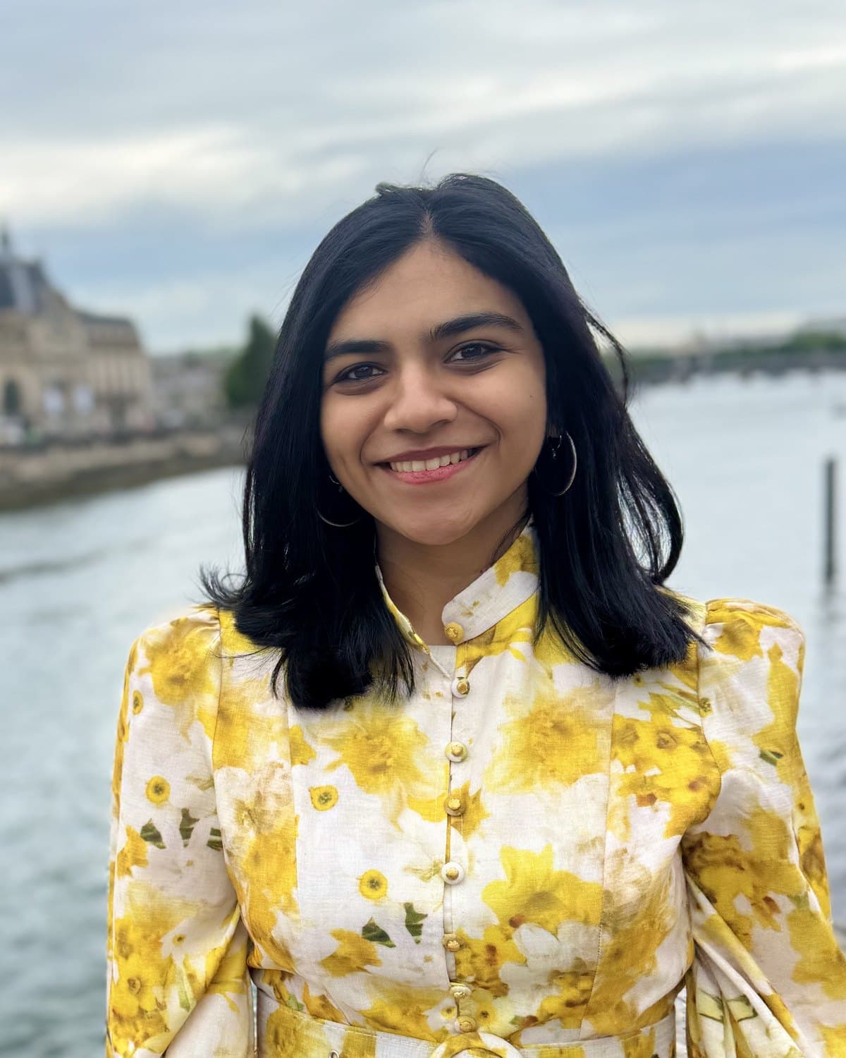 Devika Kedia, founder of Ferra, photographed outdoors beside a river.